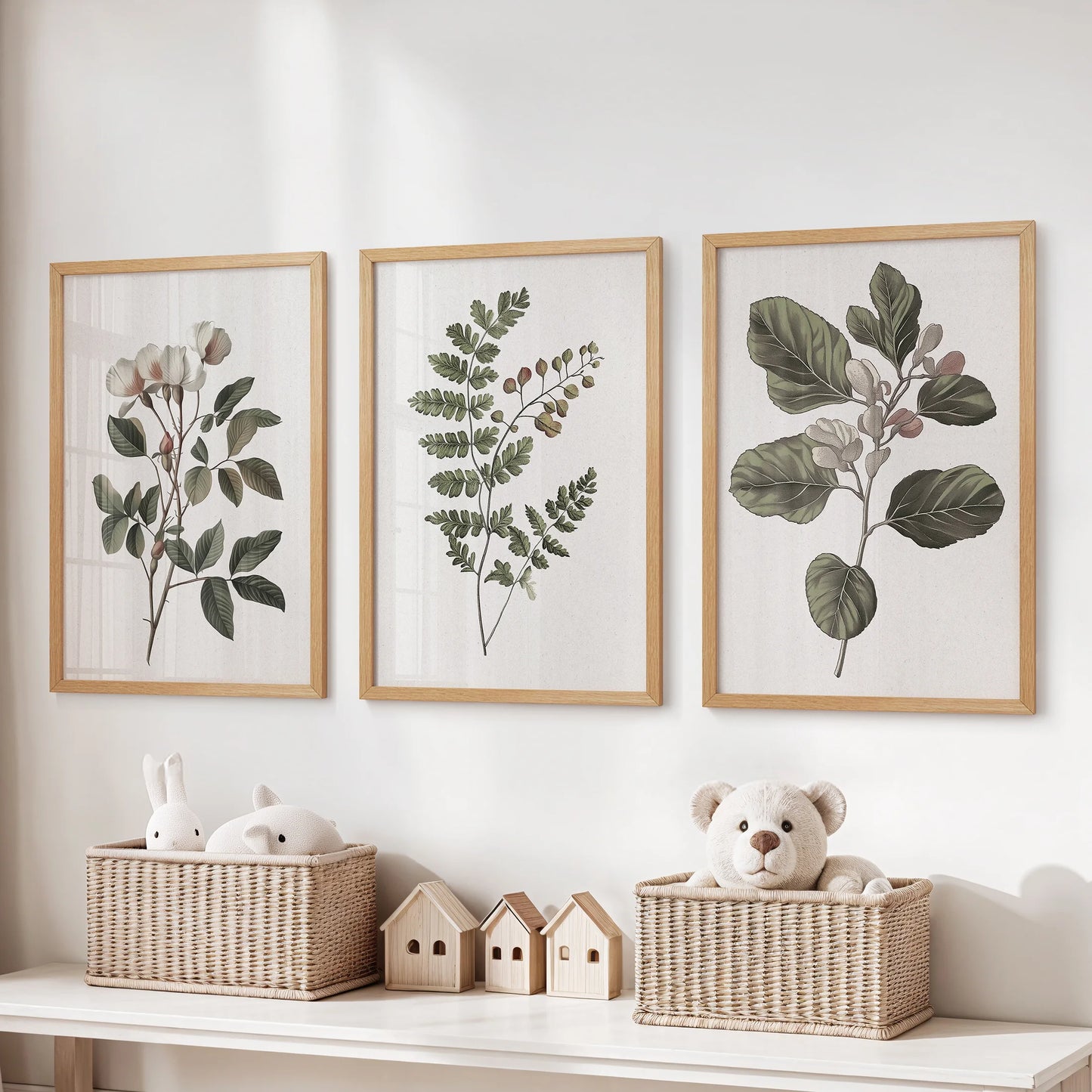 Set of 3 floral wall decor prints in natural wood frames sits above toy storage, adding warm rustic charm to the children's room.