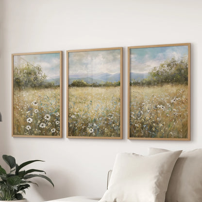 Rolling country landscape three-piece wall art hanging set in oak wood frames, scaled for the lounge wall behind the couch.