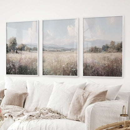 Neutral country set of 3 vintage wall art. Fields landscape painting. White frames over the couch..