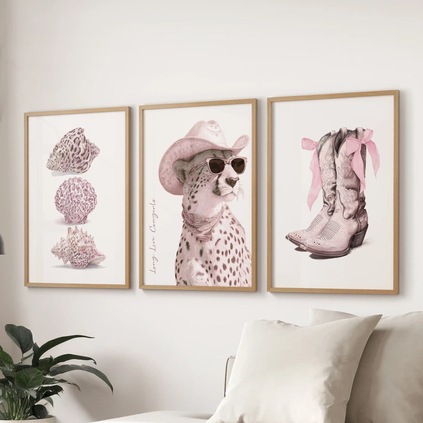 A gallery trio in wooden frames featuring pink cheetah patterns livens a lounge above the sectional, weaving blush detail into polished fun.