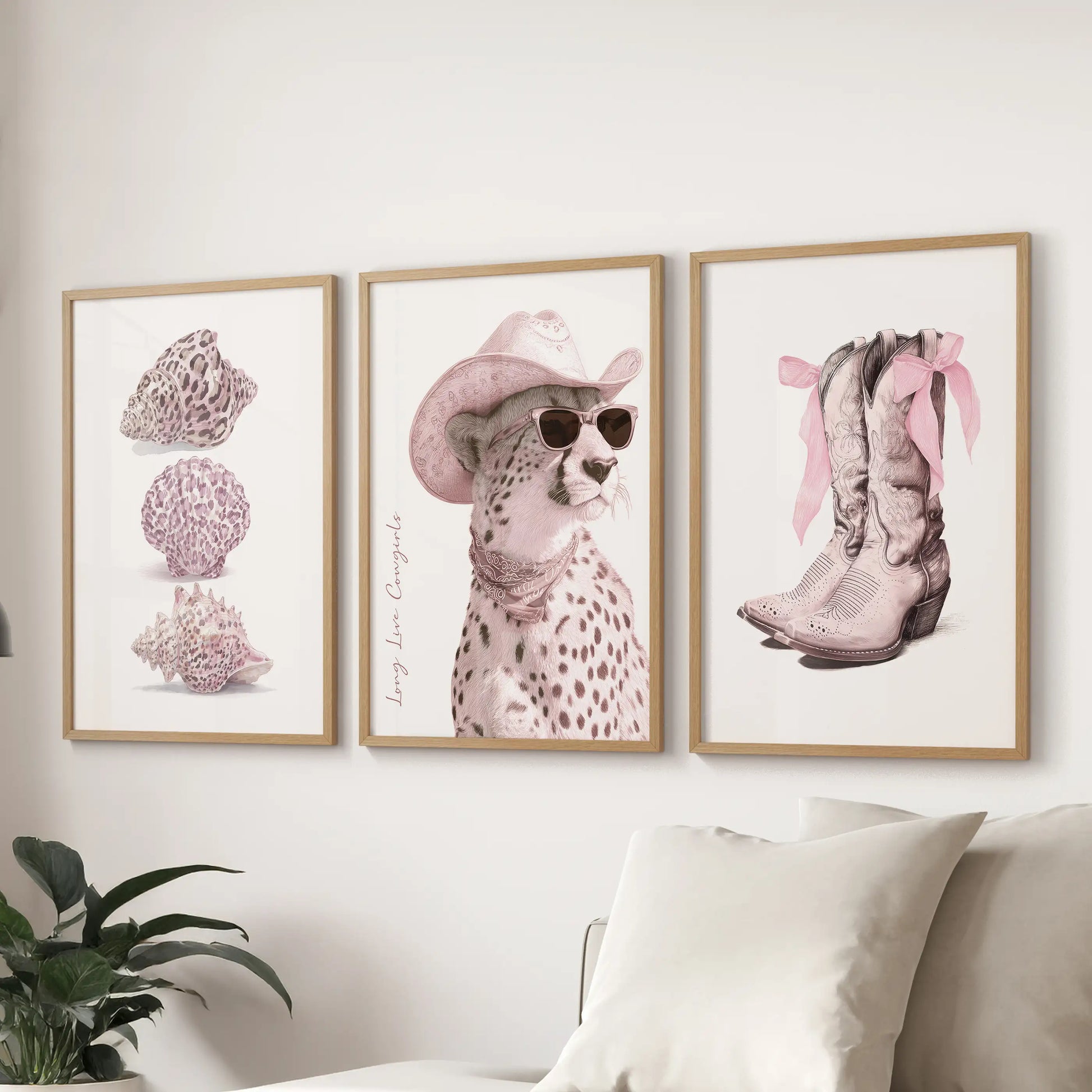A gallery trio in wooden frames featuring pink cheetah patterns livens a lounge above the sectional, weaving blush detail into polished fun.