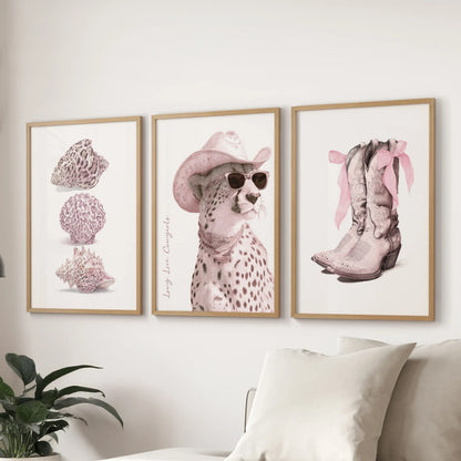 A gallery trio in wooden frames featuring pink cheetah patterns livens a lounge above the sectional, weaving blush detail into polished fun.