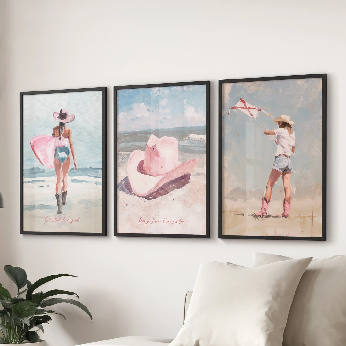 Three preppy pink beach posters in clean black frames stretch above the sitting room sectional, blending surf spirit with a crisp modern tone.