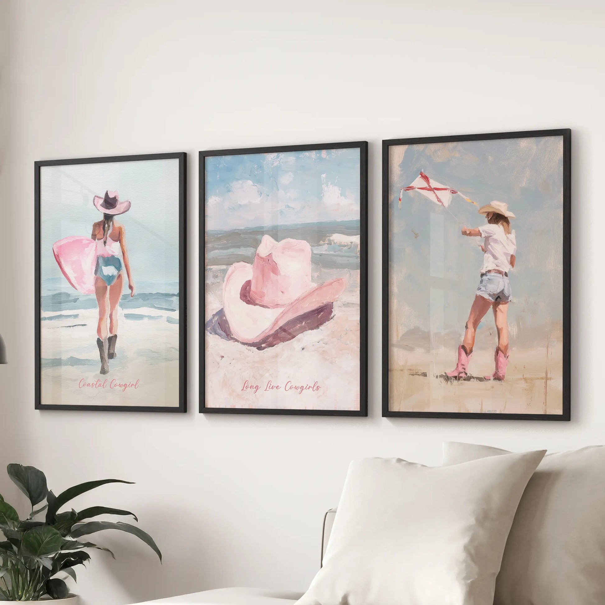 Three preppy pink beach posters in clean black frames stretch above the sitting room sectional, blending surf spirit with a crisp modern tone.