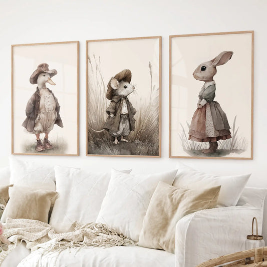 Whimsical children’s wall art with vintage animal character illustrations. Cute antique farmhouse art. Thinwood frames over the couch.