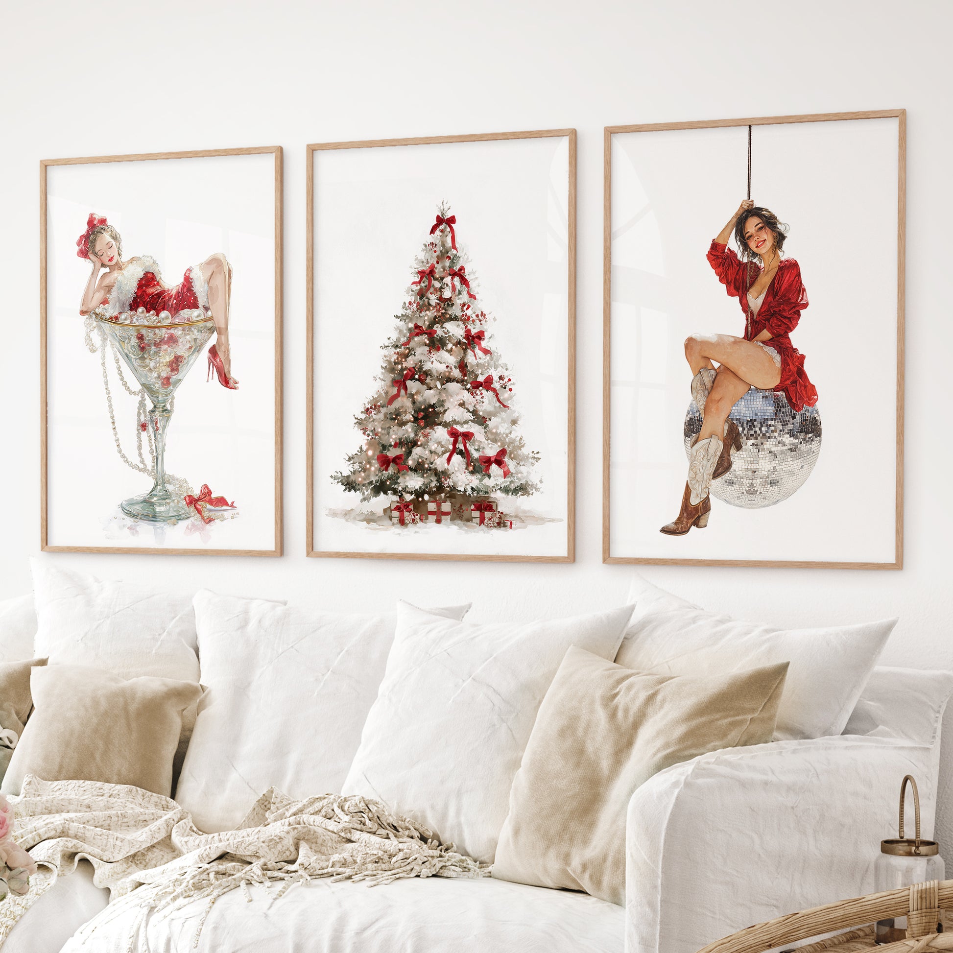 Christmas wall art set of 3 – pin up girl in martini glass, decorated Christmas tree, woman on disco ball. Thinwood frames over the couch.