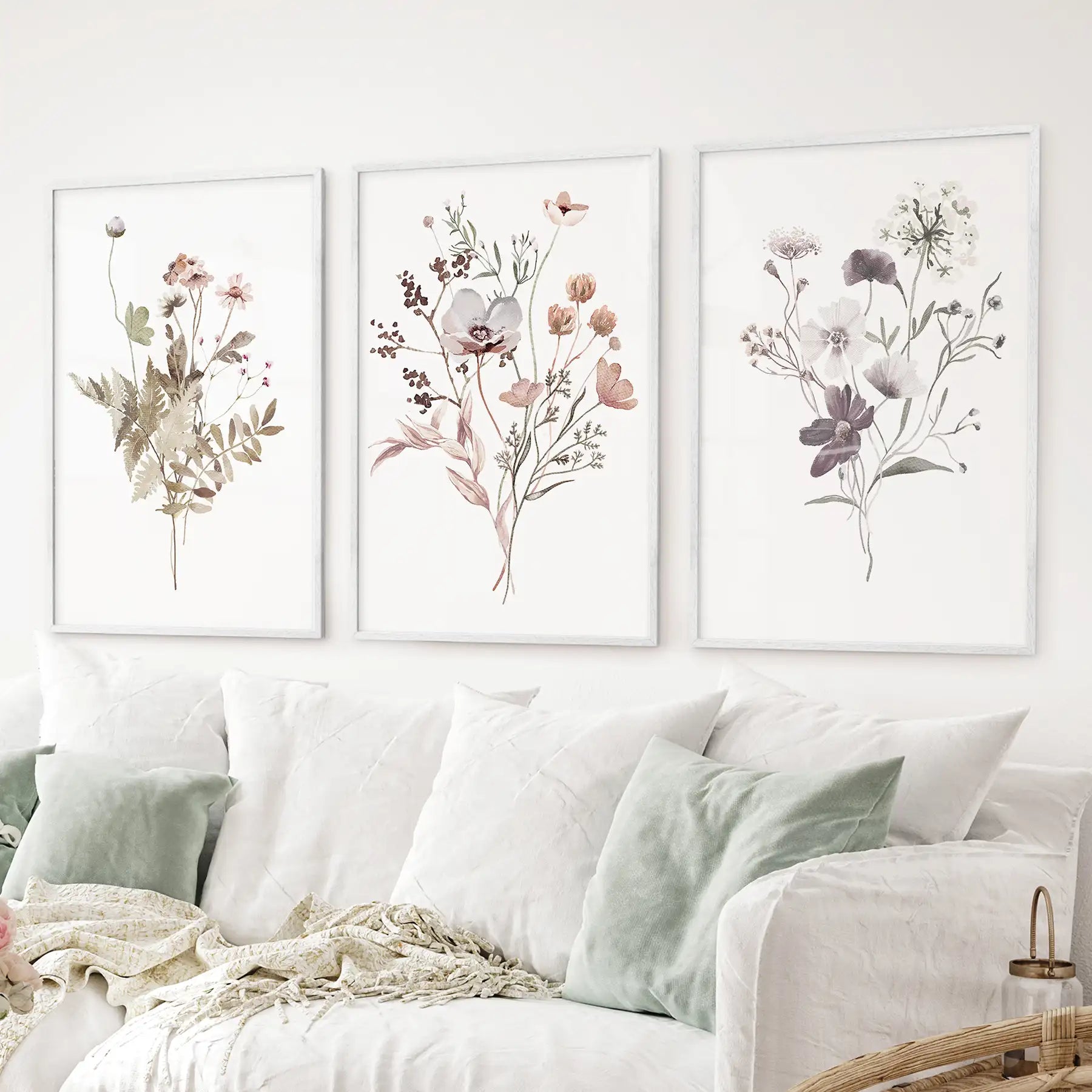 Delicate watercolor wildflower prints in white oak frames for modern spaces
