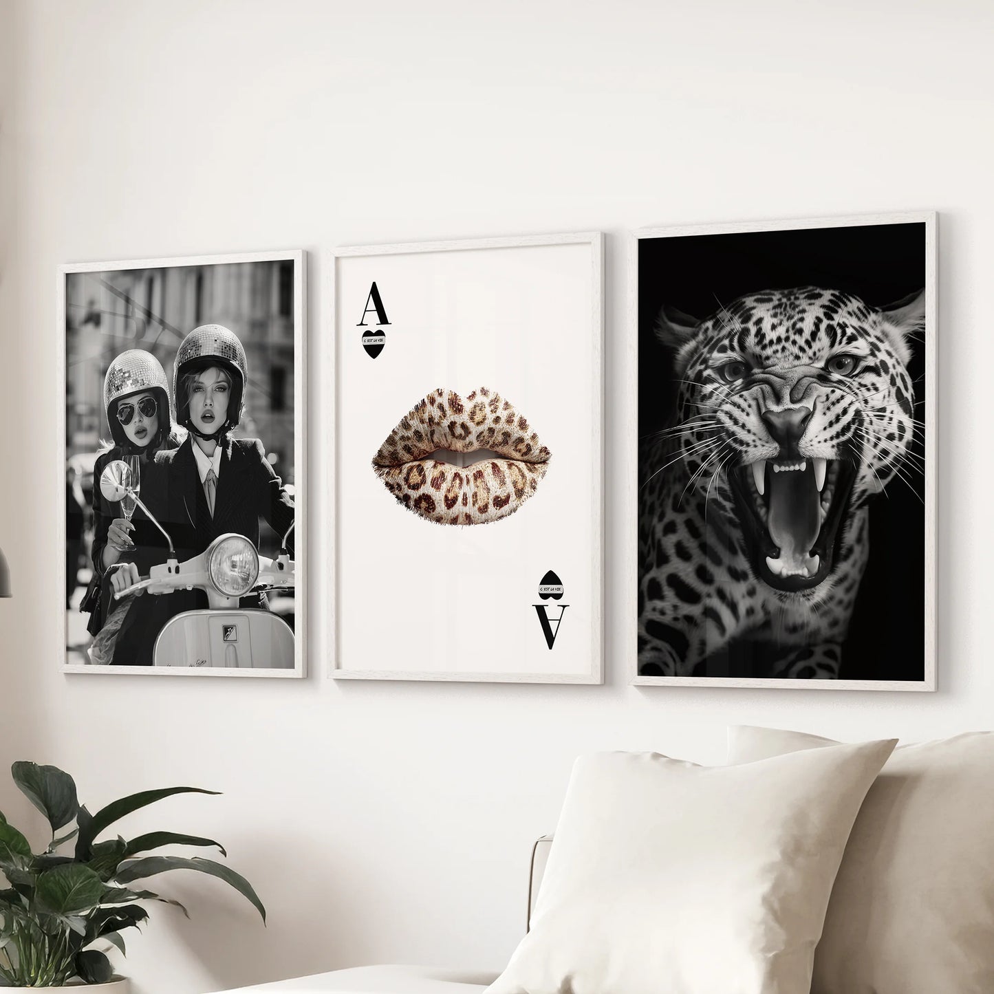 Set of three vintage fashion artworks in white frames, arranged above the sofa for a refined touch in the living room.