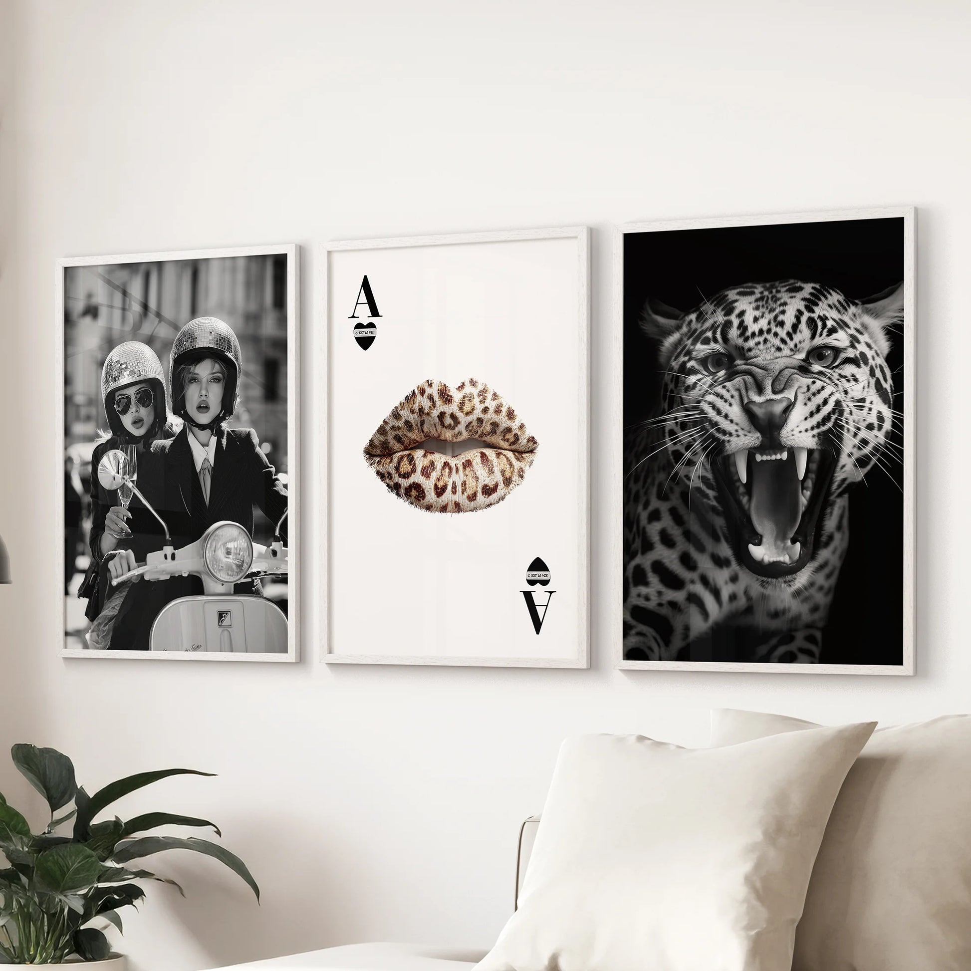 Set of three vintage fashion artworks in white frames, arranged above the sofa for a refined touch in the living room.