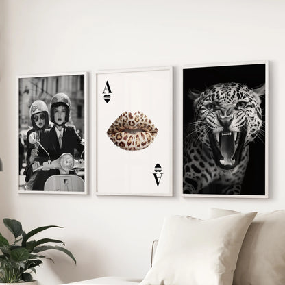 Set of three vintage fashion artworks in white frames, arranged above the sofa for a refined touch in the living room.