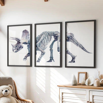 Watercolor triceratops skeleton wall art set of three framed prints hanging above a wooden dresser in a cozy nursery.