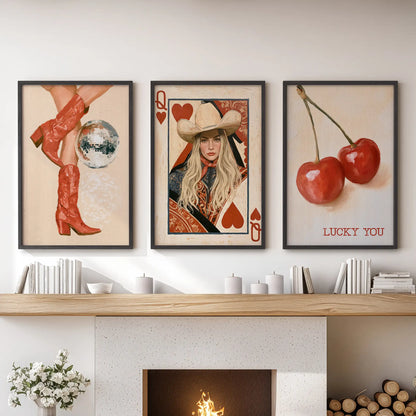 Above the fireplace, a three-poster wall art set of red cowgirl boots in black frames creates a striking family room focal point.