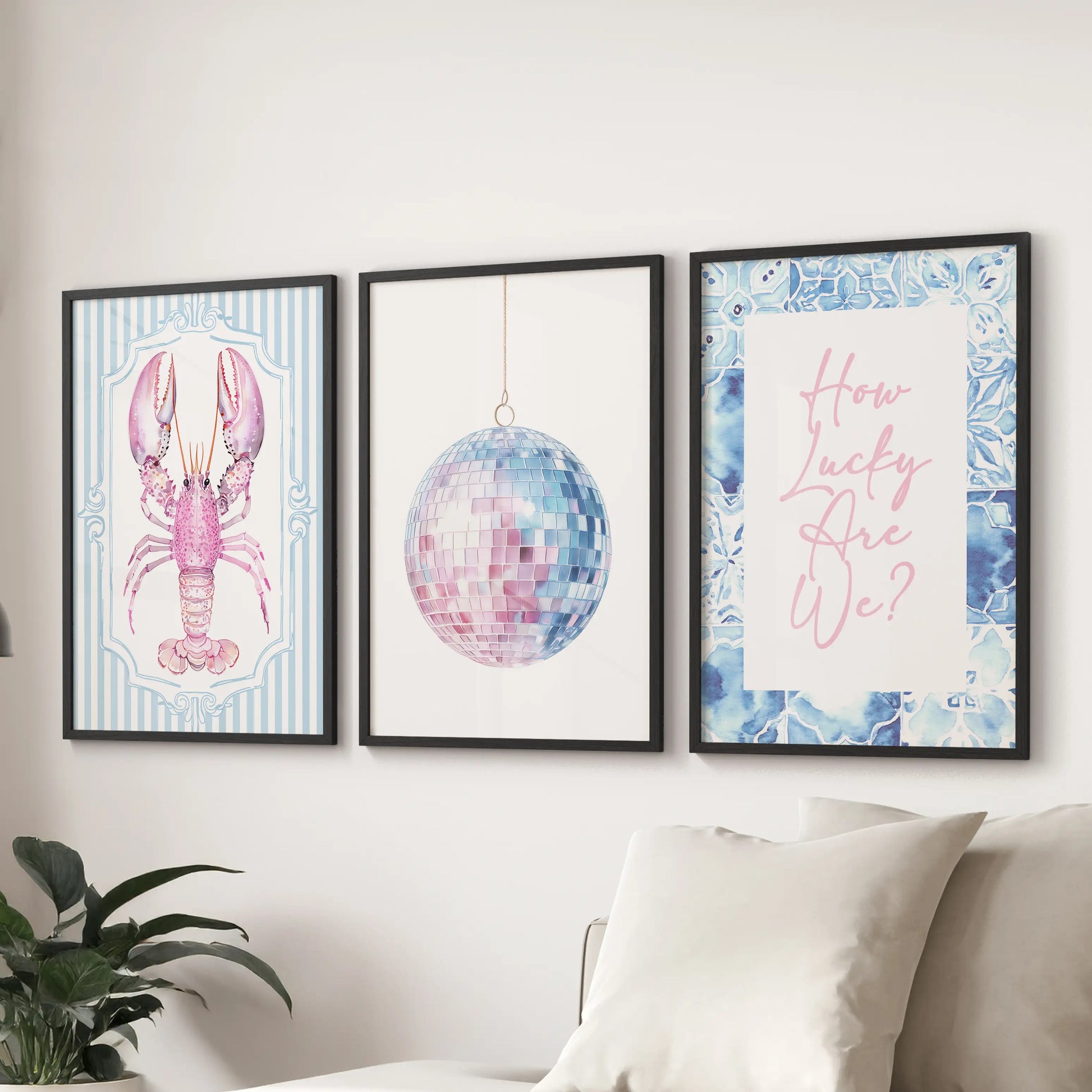 Large lobster illustration prints framed in black line the wall above the sectional, giving the sitting room modern seaside whimsy.