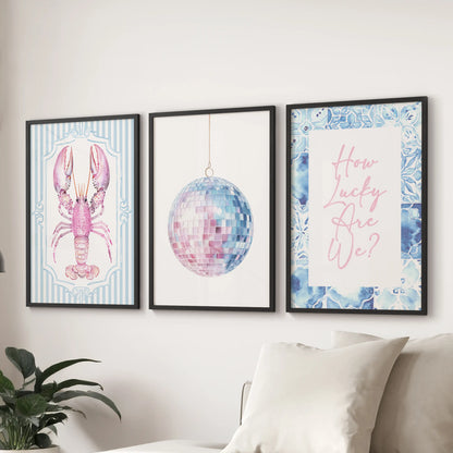 Large lobster illustration prints framed in black line the wall above the sectional, giving the sitting room modern seaside whimsy.