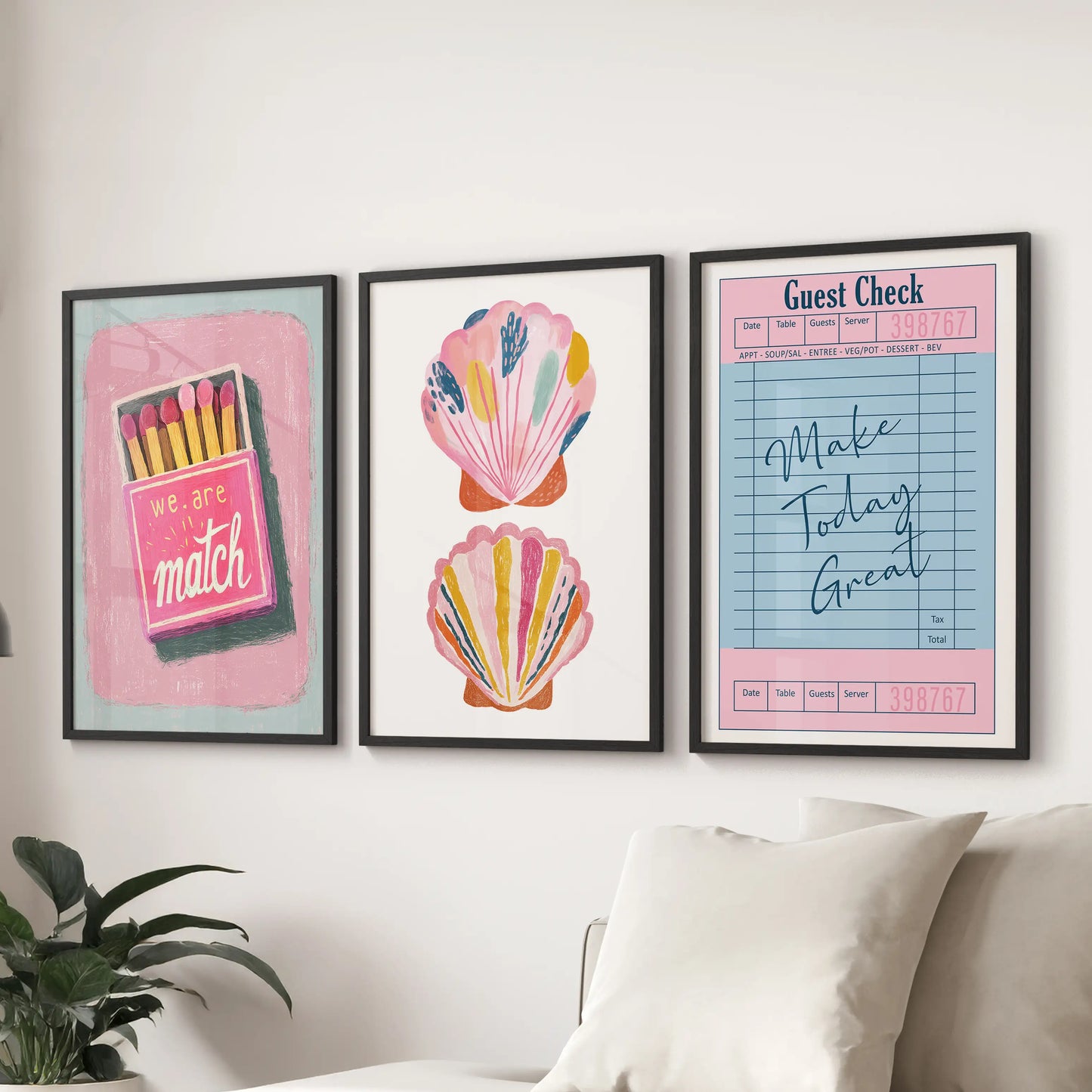Three black-framed art prints with positive typography brighten the family room wall above the sectional sofa with cheerful color.