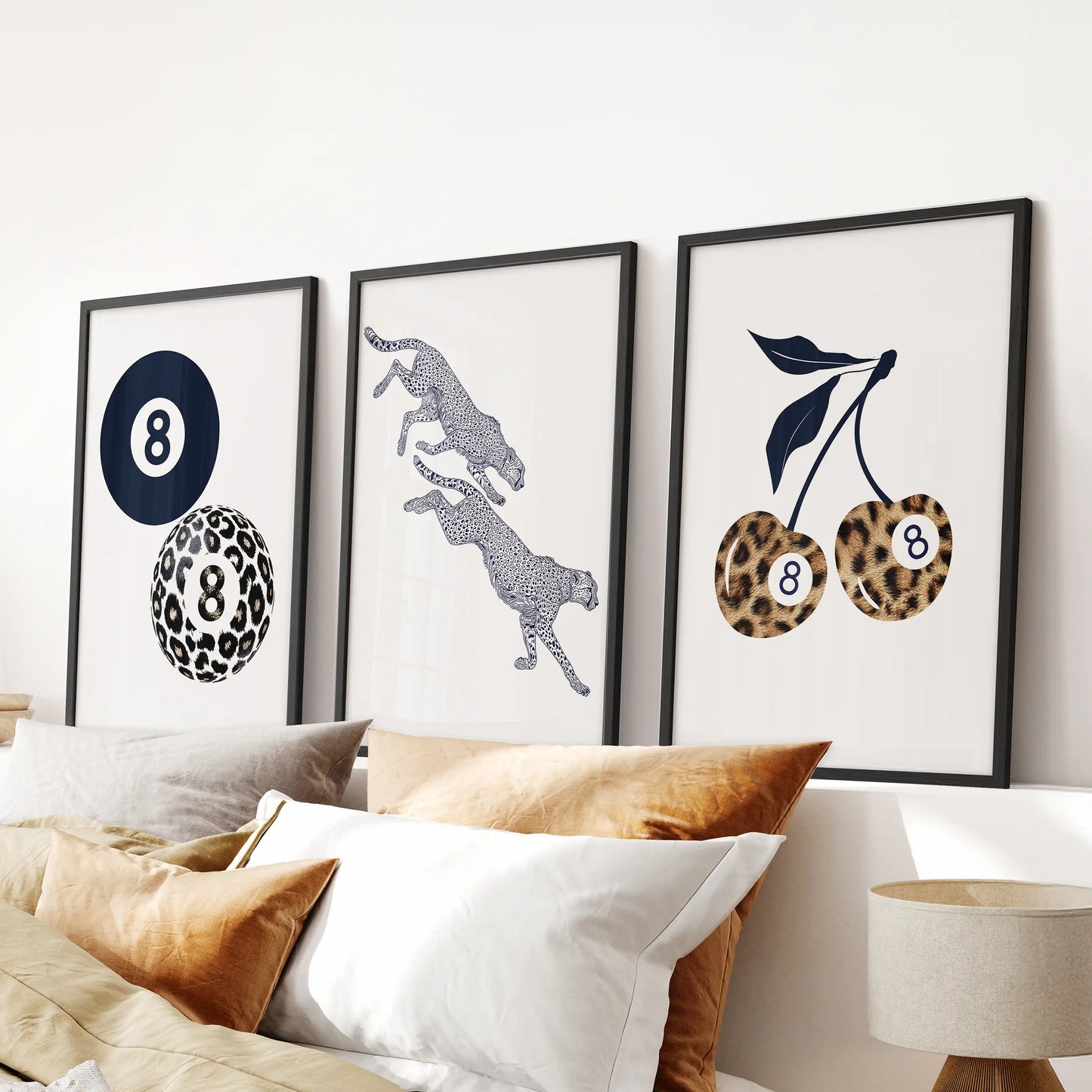 Retro pool-ball cherries motif, a set of three posters, turns into bold bedroom wall art in black frames mounted over the headboard.