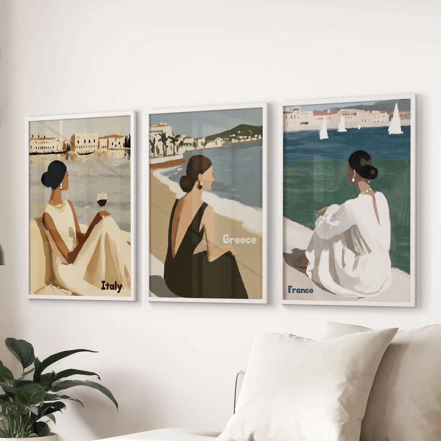 European seaside travel 3-piece art print set anchors the living room above the sectional, its white frames crisp against fresh, airy neutrals.