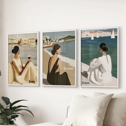 European seaside travel 3-piece art print set anchors the living room above the sectional, its white frames crisp against fresh, airy neutrals.