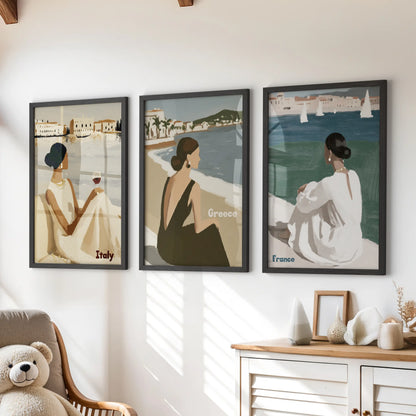 Elegant female figures three piece wall decor in sleek black frames hangs over the playroom chest of drawers, lending airy, fashion-forward coastal charm.