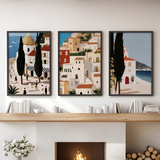 A 3-panel wall print set of vintage Mediterranean travel art in black frames crowns the family room fireplace with warm, wanderlust light.
