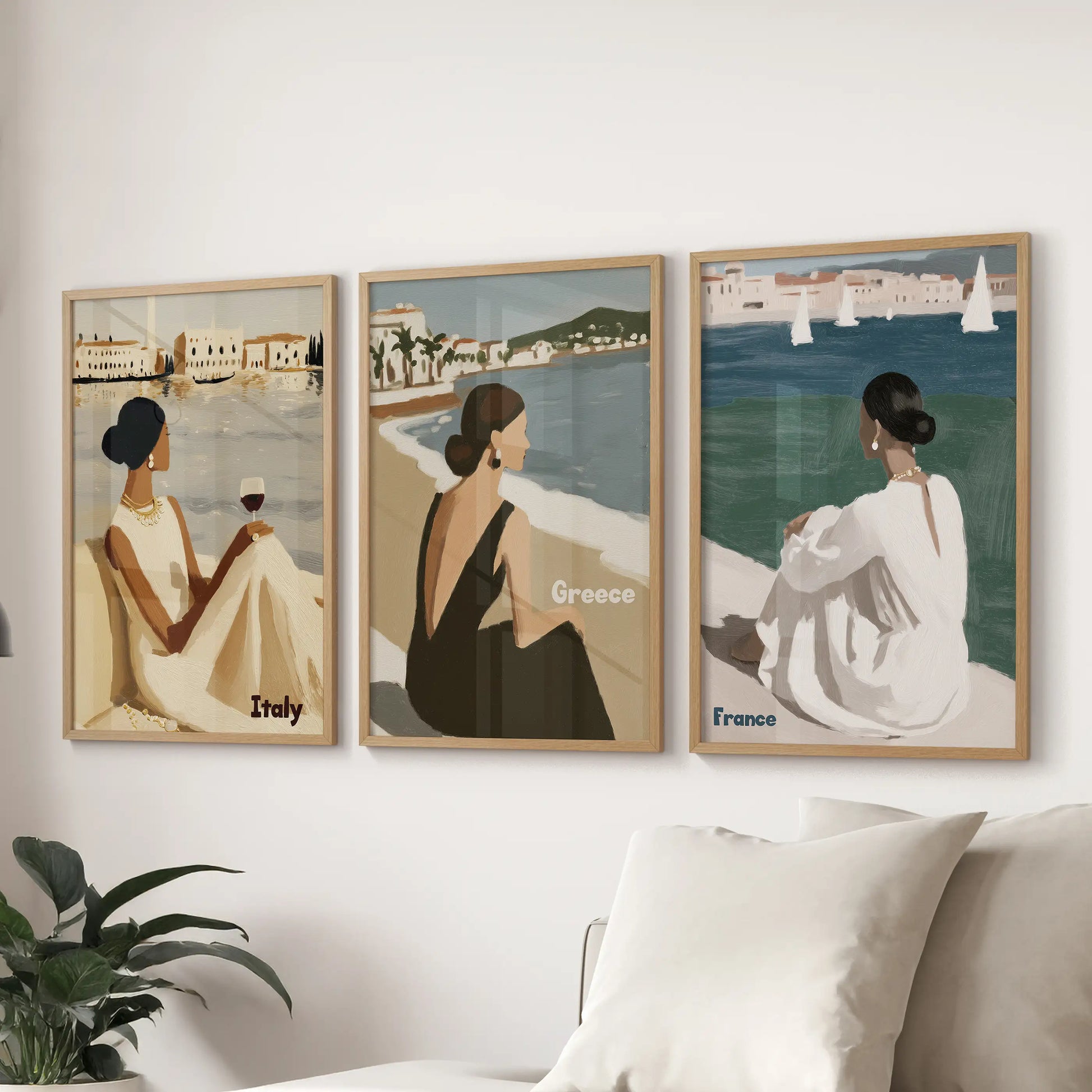 Mediterranean woman seaside travel wall art set of 3 thin wood framed prints over sectional sofa in living room