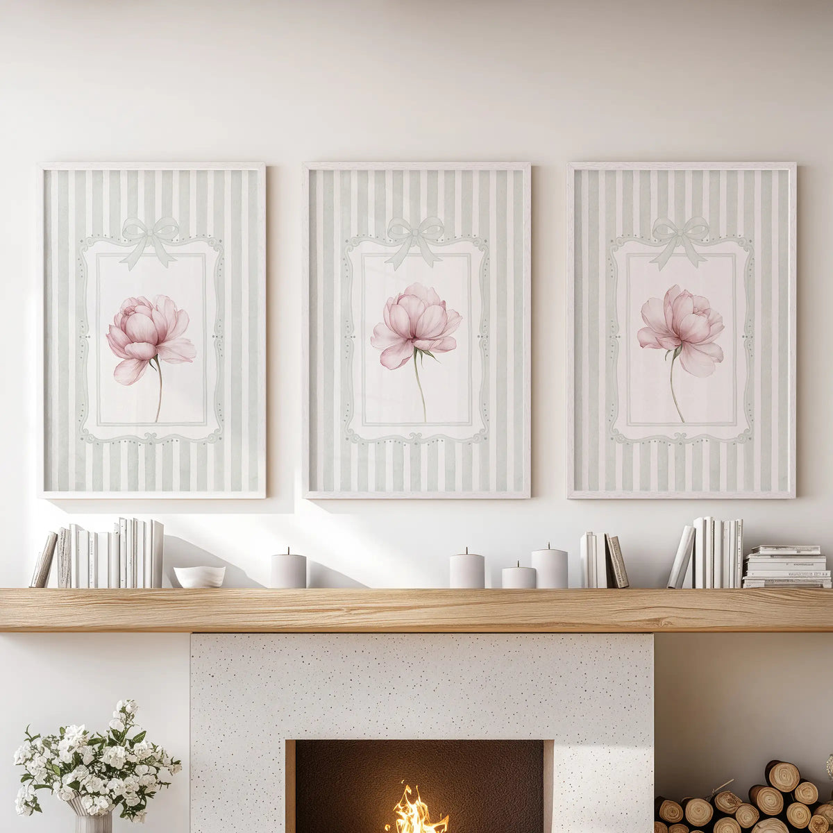 Set of three floral wall art prints in white frames, featuring pink peonies on sage green stripes above a lounge mantelpiece.