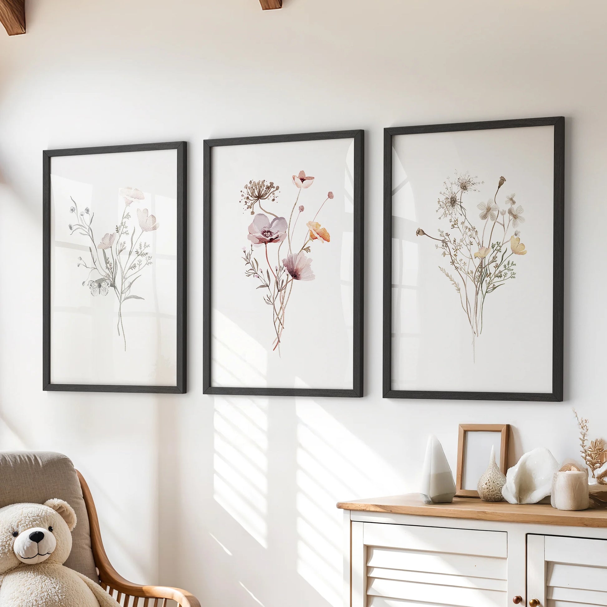 Watercolor wildflowers wall art, set of three, in black frames adds a gentle pop to a children's room when hung above the dresser.