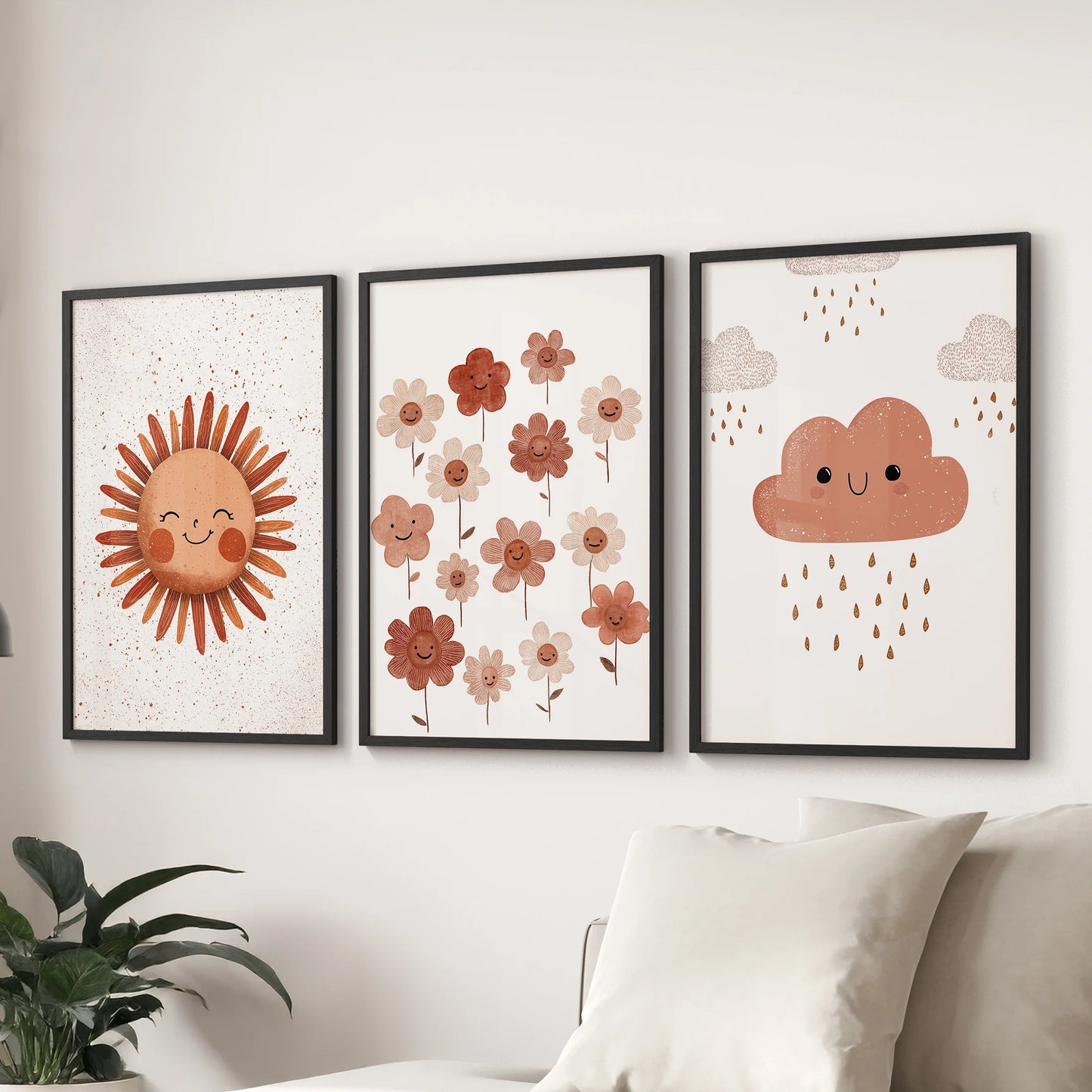 Sunshine, flowers, and cloud set, a trio of wall art in black frames, sits above the living room sectional for an airy, kid-friendly accent.