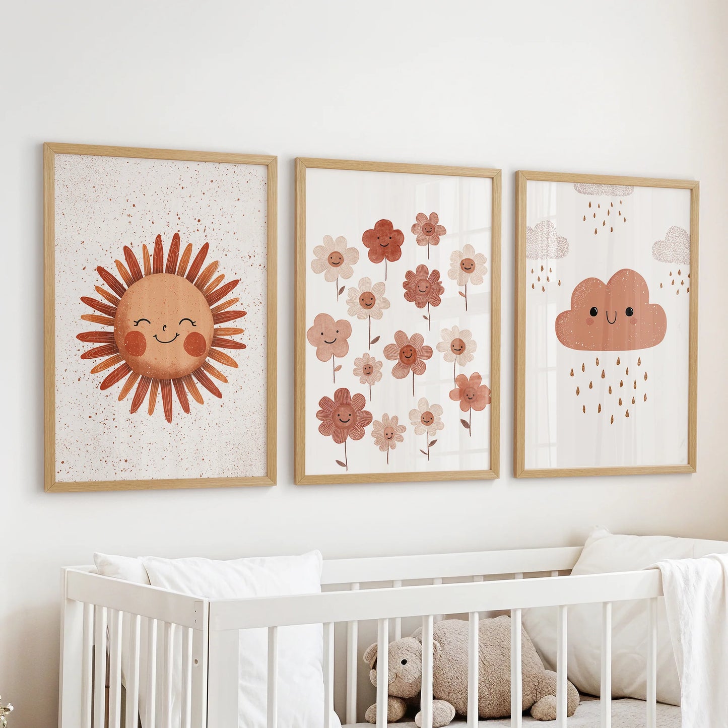 Floral, sun nursery print, three wall art pictures in oak frames, arranged over the crib to bring a gentle, nature-inspired feel to the infant room.