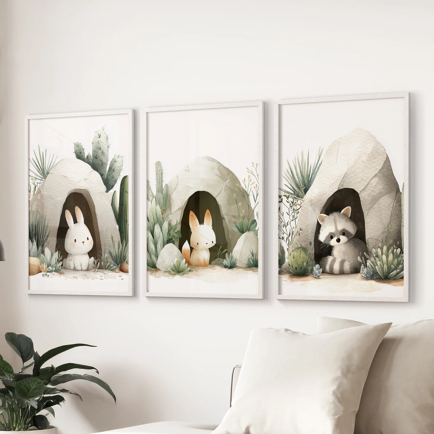 Scandinavian nursery décor: neutral animal triptych with sage green plants and rock caves.