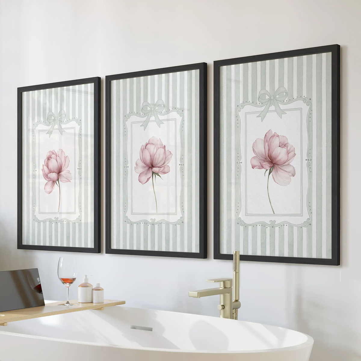 Pink peony wall art set of three in black frames, displayed over a freestanding tub in a bathroom.