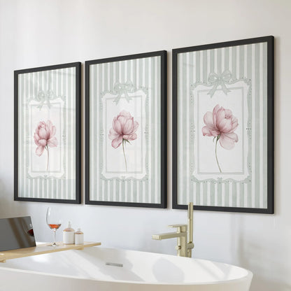 Pink peony wall art set of three in black frames, displayed over a freestanding tub in a bathroom.