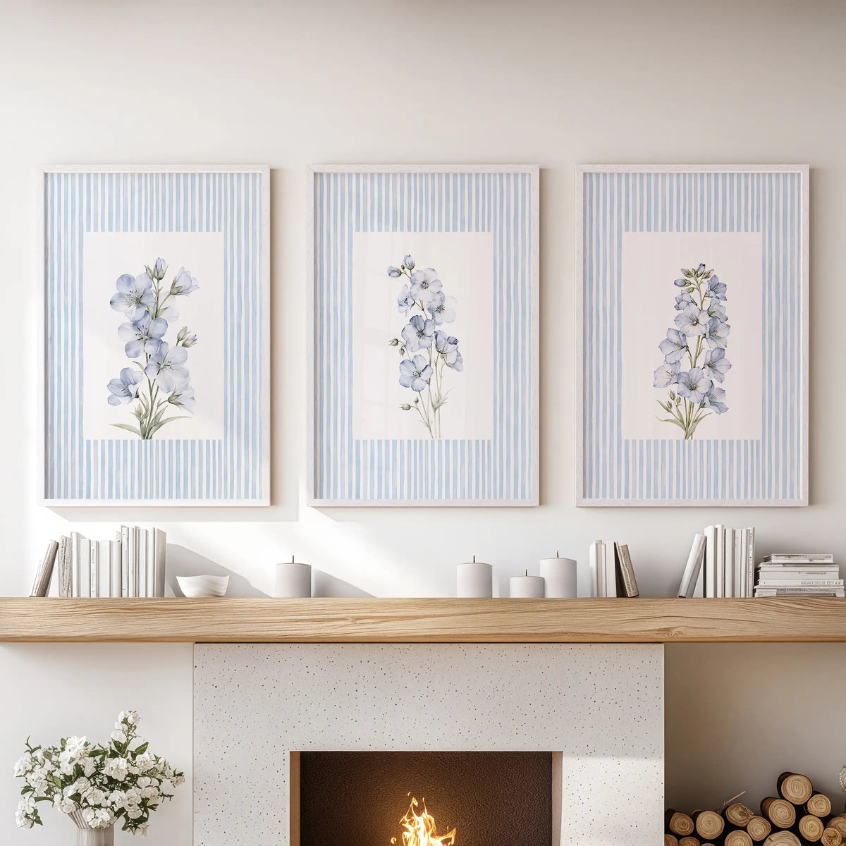 French country flowers 3-print wall art set in white frames, hanging above the fireplace mantel in a lounge.