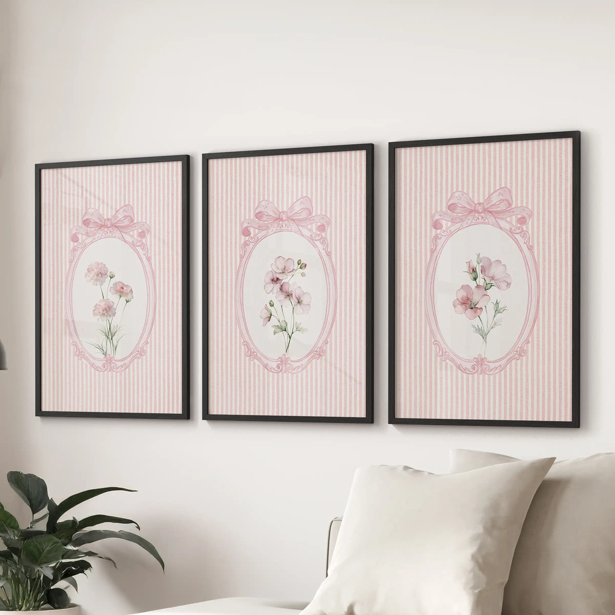 French pink florals in a three-piece wall art set, presented in black frames over a sofa in the sitting room.