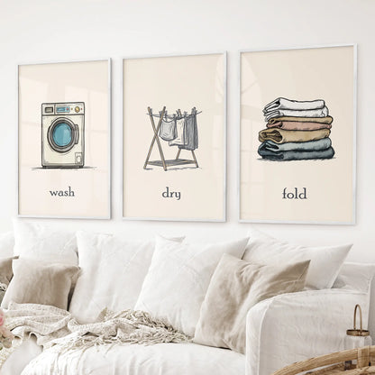 Wash Dry Fold laundry room decor set washing machine, clothesline, folded clothes. White frames above the sofa.