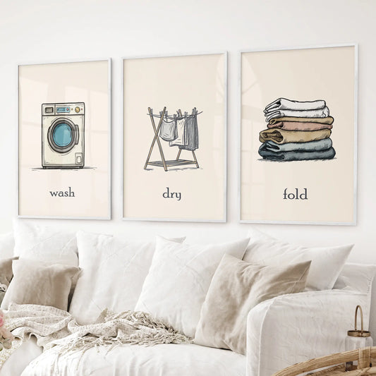 Wash Dry Fold laundry room decor set washing machine, clothesline, folded clothes. White frames above the sofa.