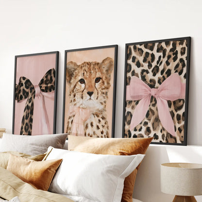 Girly glam wild cat prints, set of 3 wall art in black frames, aligning cleanly over the bed to add a polished feline touch to the bedroom.