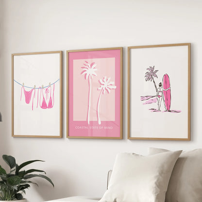 A 3-print wall set in natural oak frames brings girly coastal charm to the family room, displayed over the couch.
