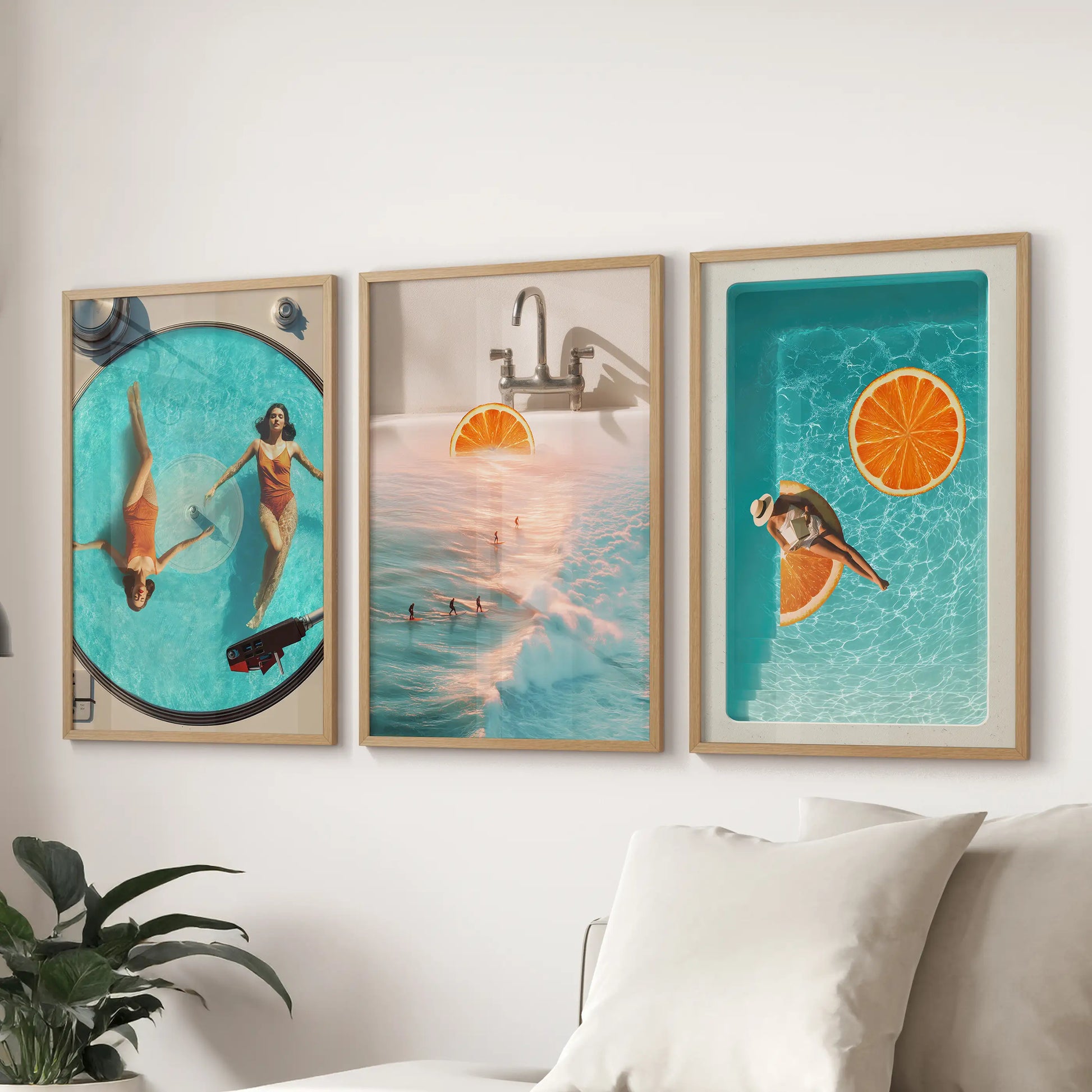Three oak-framed coastal collage art prints hang above the lounge sectional, tying the space together with sun-washed blue and orange.