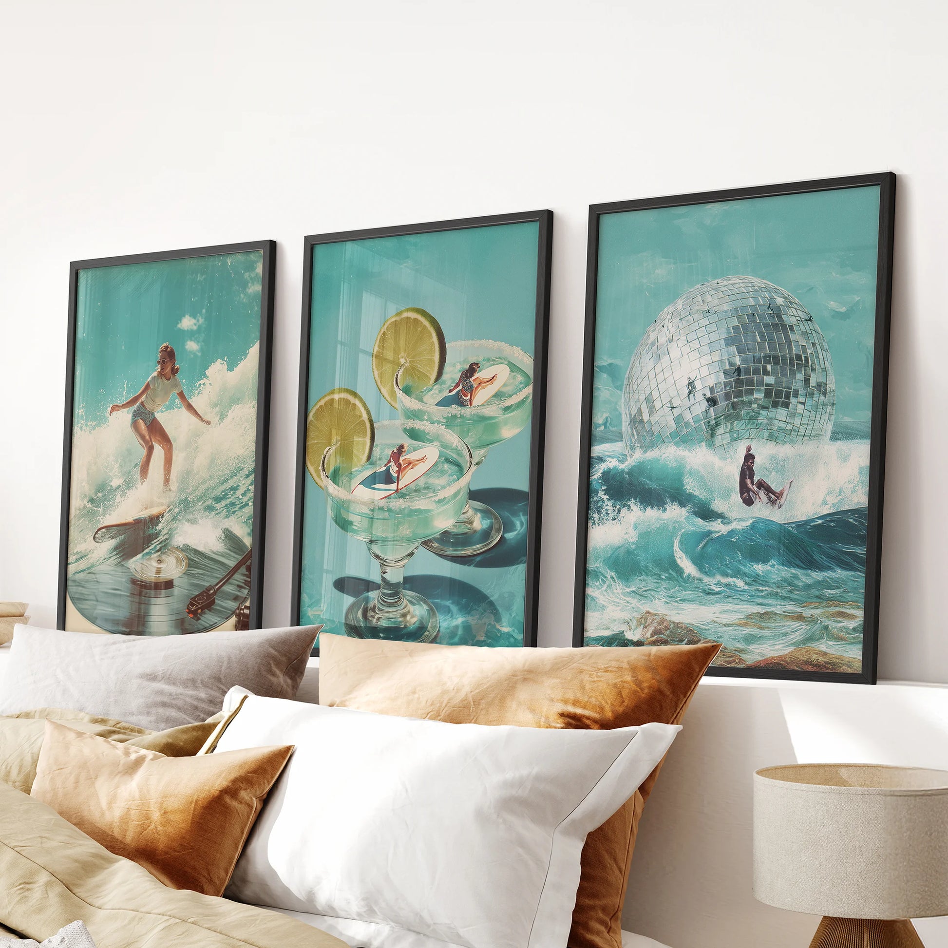 A set of 3 posters featuring surfer girl art brightens the bedroom, displayed over the bed in sleek black frames with retro summer blues.