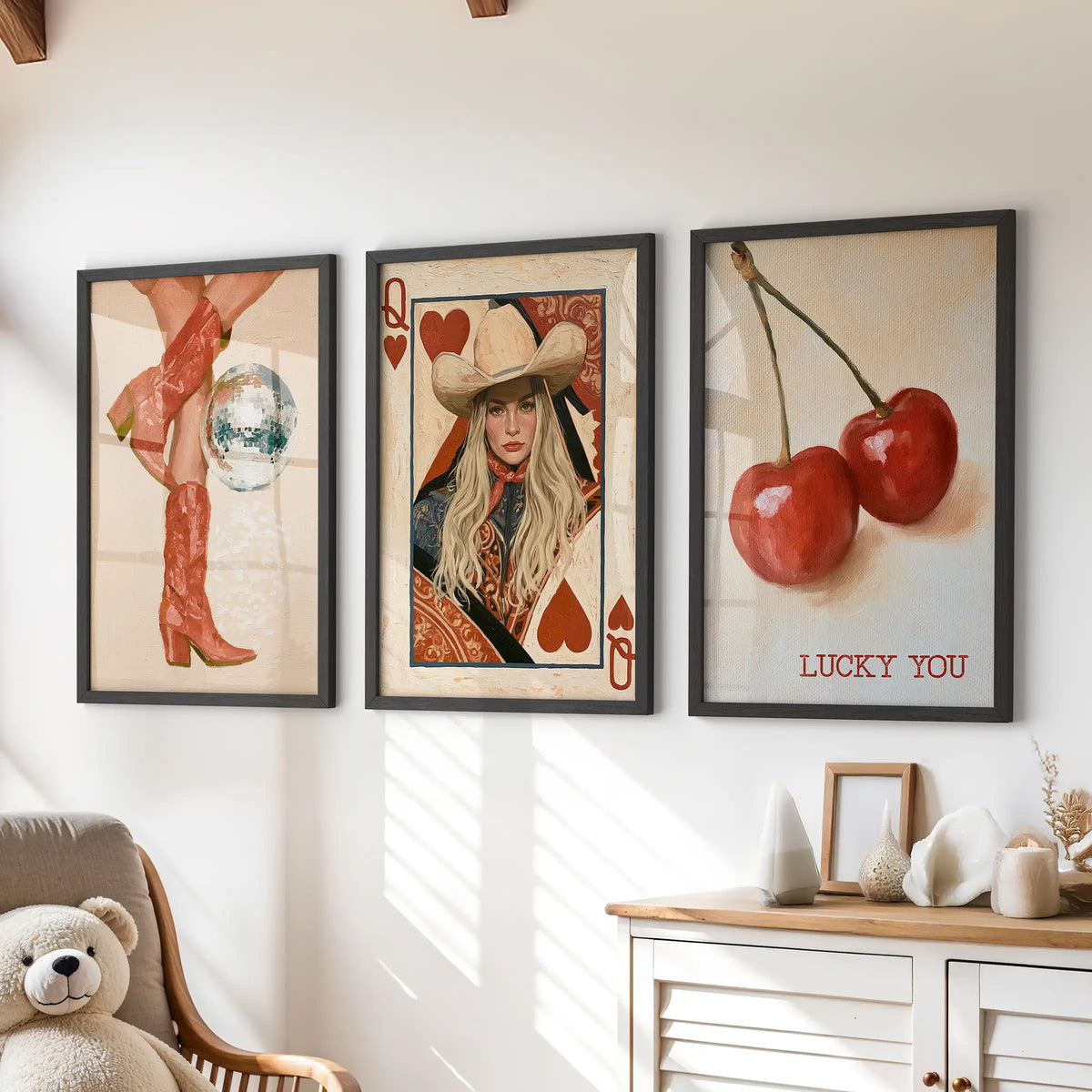 Disco cowgirl set of three posters brings a playful gallery look in black frames over a chest of drawers in a children's room.