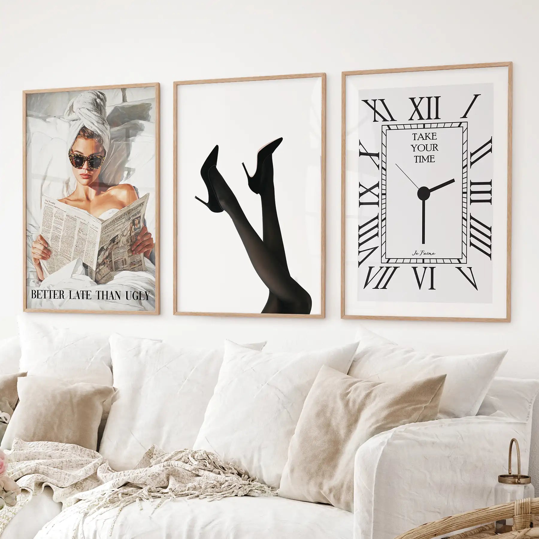 Contemporary fashion wall art collection with woman reading, high heels, and minimal clock design. Thinwood frames above the sofa.