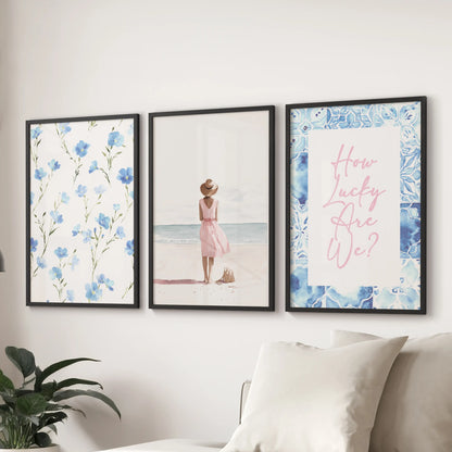 Pastel blue coastal prints, a 3-piece wall art set, arrive in sleek black frames and hang above the couch to freshen a relaxed sitting room.