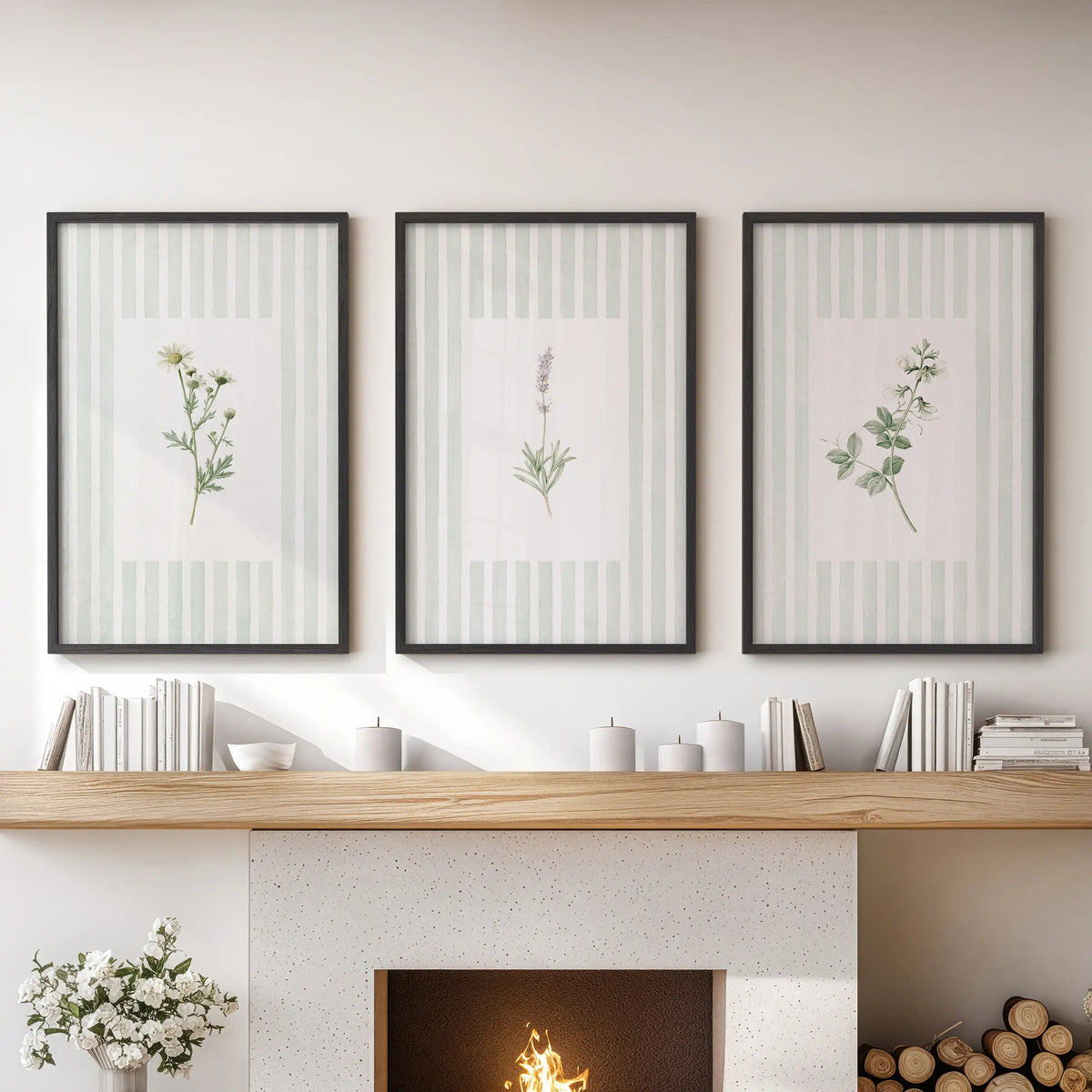 A set of three green floral botanical prints in black frames is arranged above the mantel in a family room.