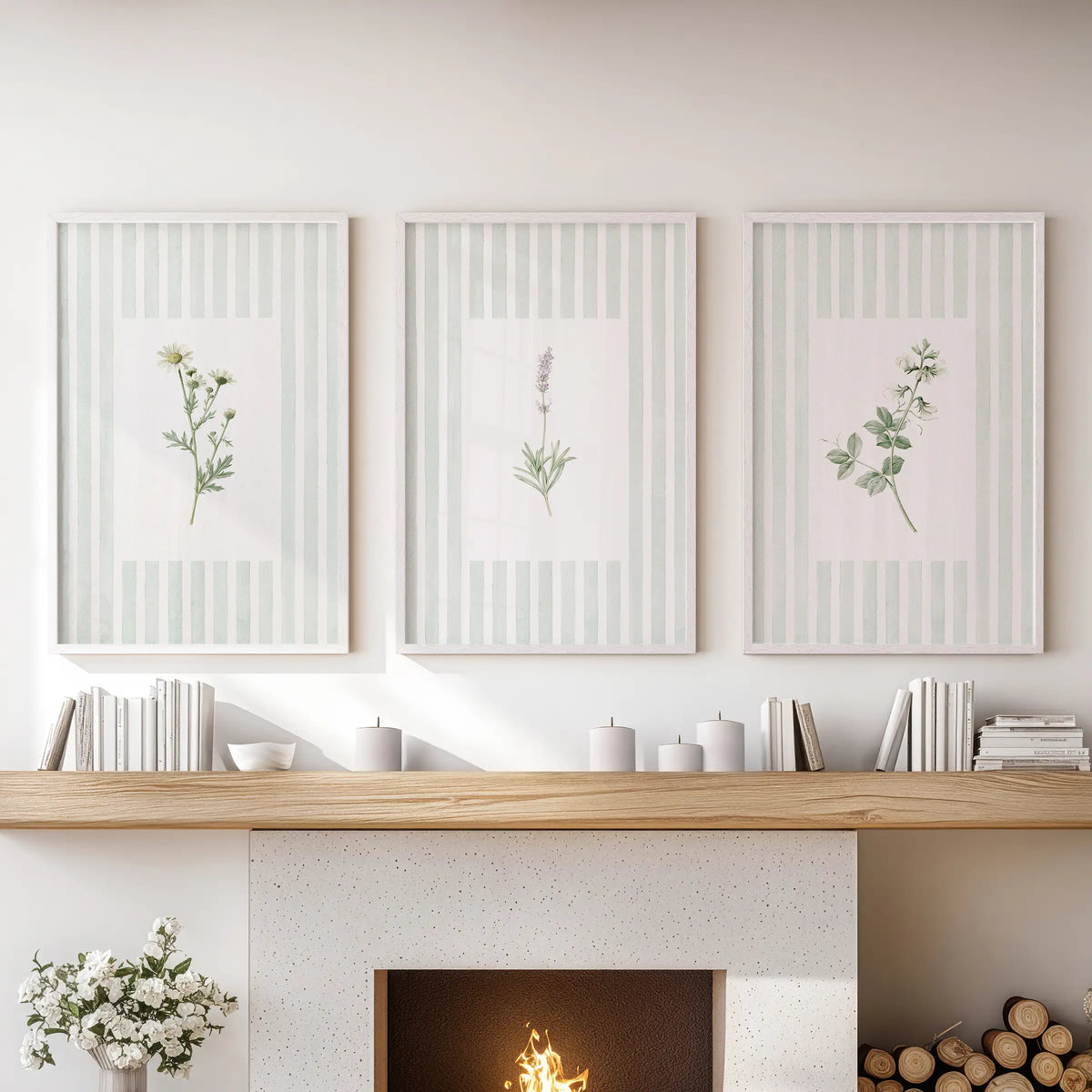 A set of three green floral botanical prints in white frames hangs over the fireplace mantel in a sitting room.