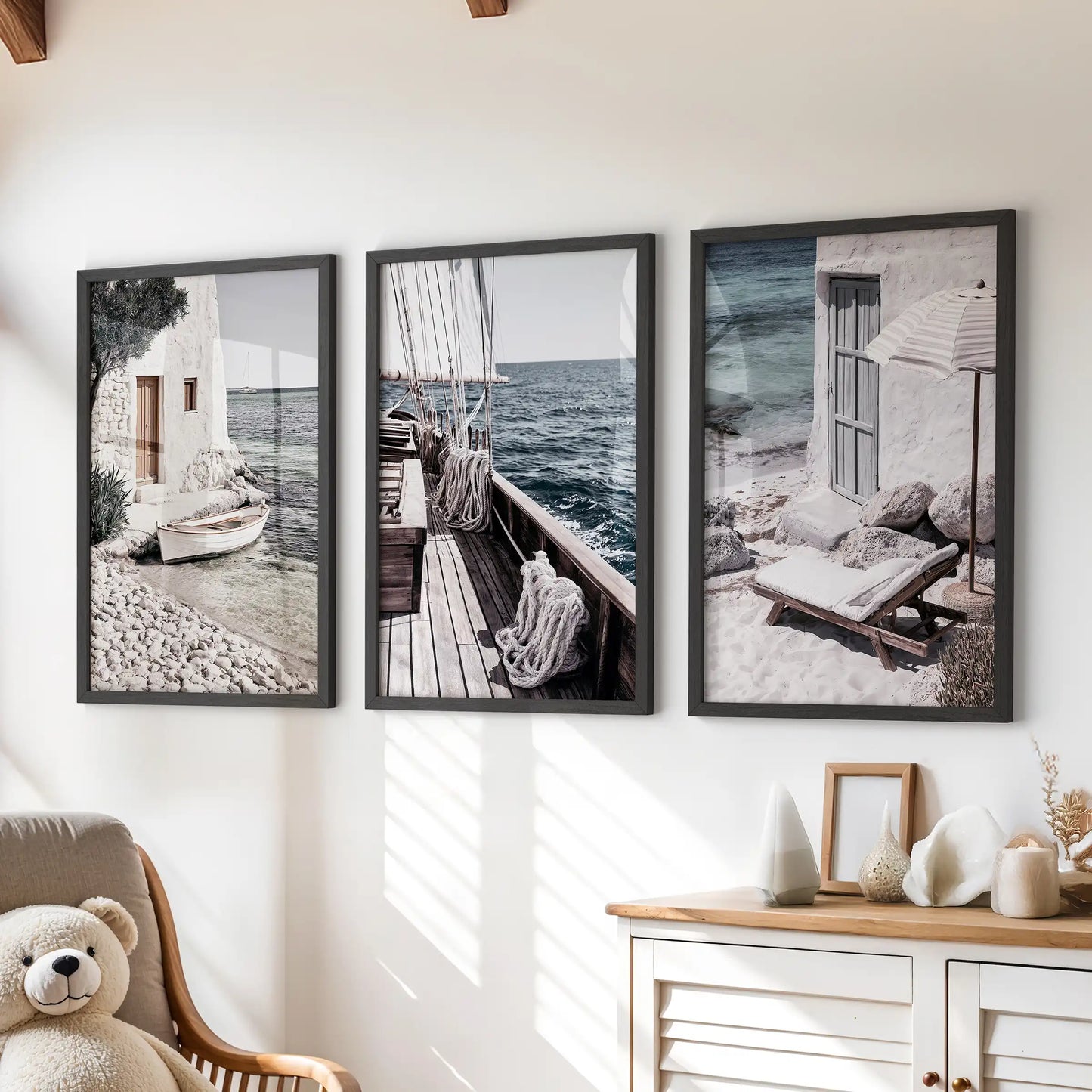 Greek island seascapes poster set of 3 in black-framed prints, hung over a playroom dresser for a crisp nautical accent with sunlit, coastal charm.