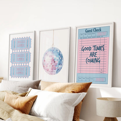 Above the bed, this white-framed set of three coastal prints features a guest check, disco ball, and beach ticket in preppy blue and pink tones.