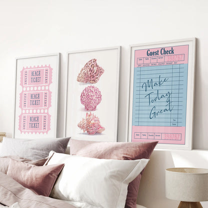 A white-framed gallery trio of guest check prints hangs above the headboard, bringing diner-chic charm to a pink bedroom.