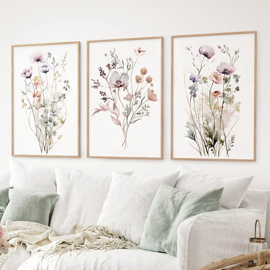 Set of 3 muted watercolor floral prints featuring poppies, anemones, and meadow grasses. Thinwood frames over the couch.