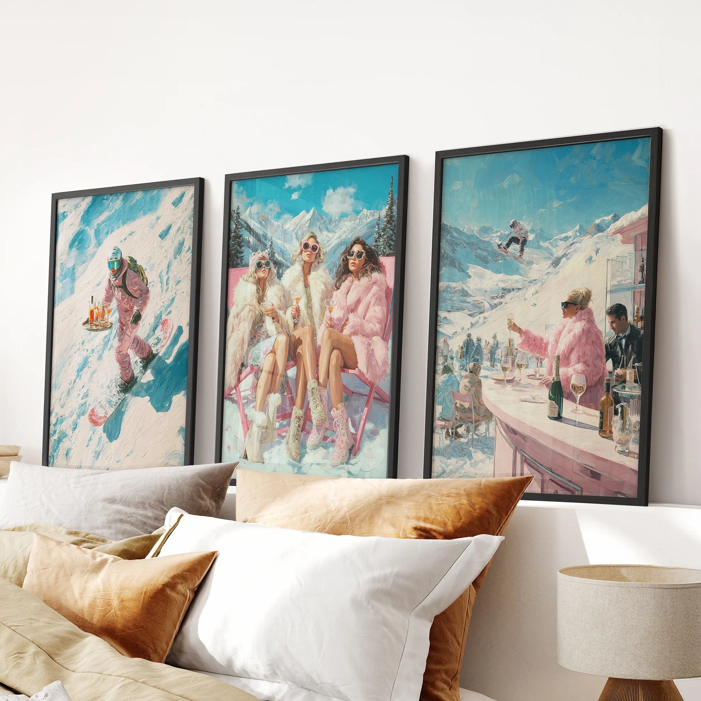 A stylish wall art 3 set featuring apres-ski scenes in sleek black frames, hung over the bed headboard to give the bedroom a cozy lodge tone.